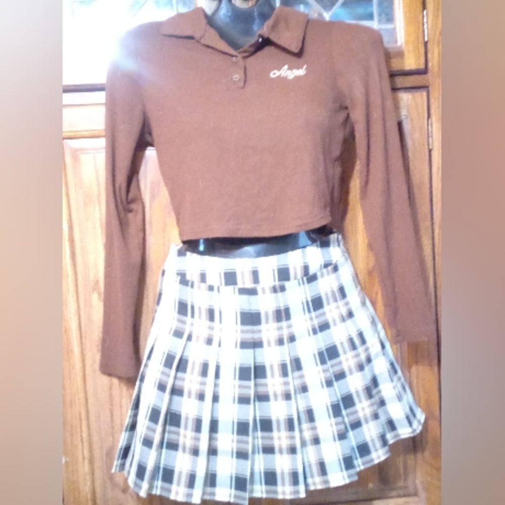 Shirt and skirt together, skirt is a small size and long sleeve shirt is Medium